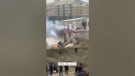 Man in China uses fireworks to fight off bulldozer sent to  